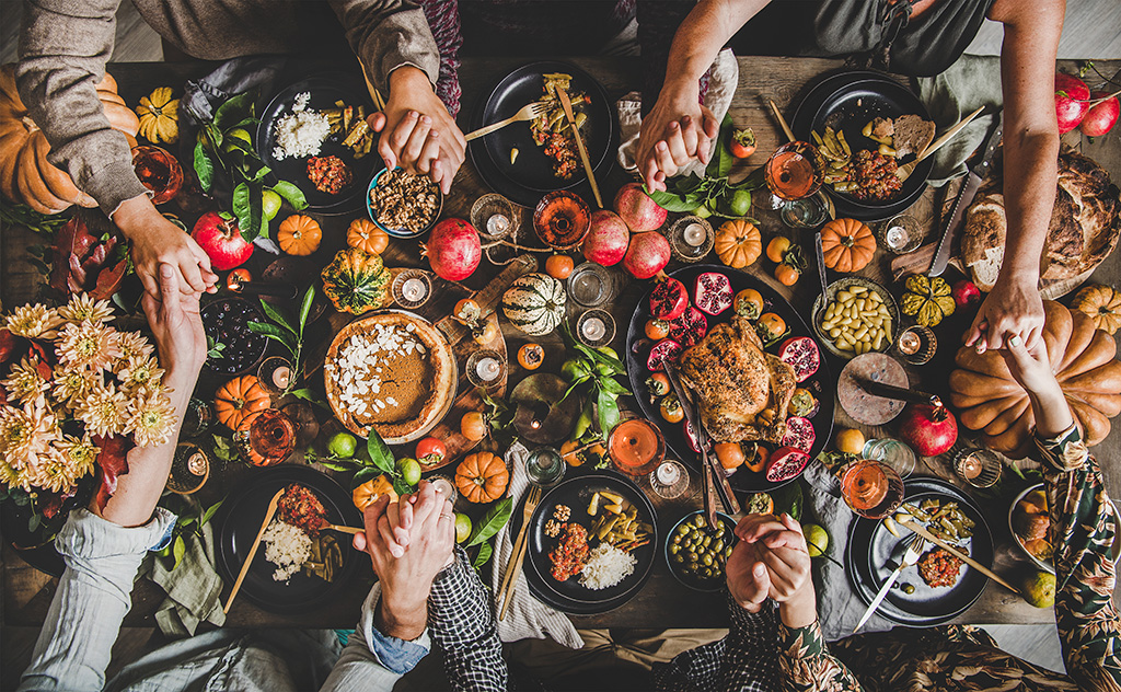 Thanksgiving table with hands